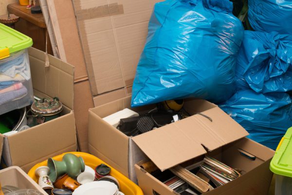 Boxes and bags in need of hoarder clean out and hoarder junk removal services