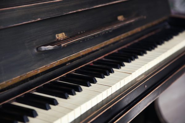 Old piano in need of piano removal services