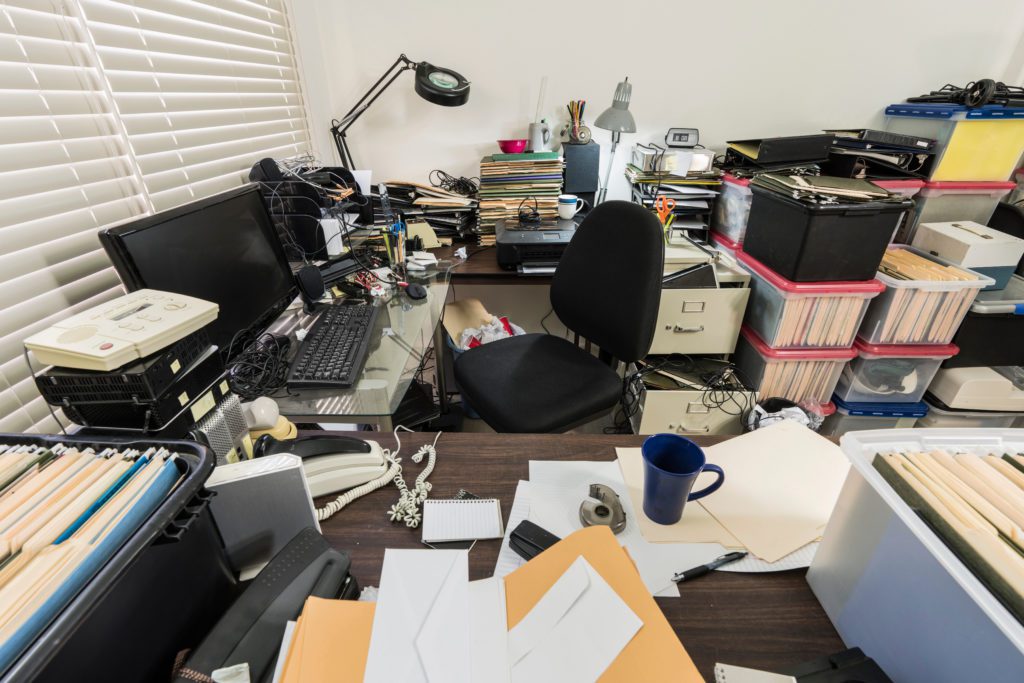 messy cubicle in need of cleanout