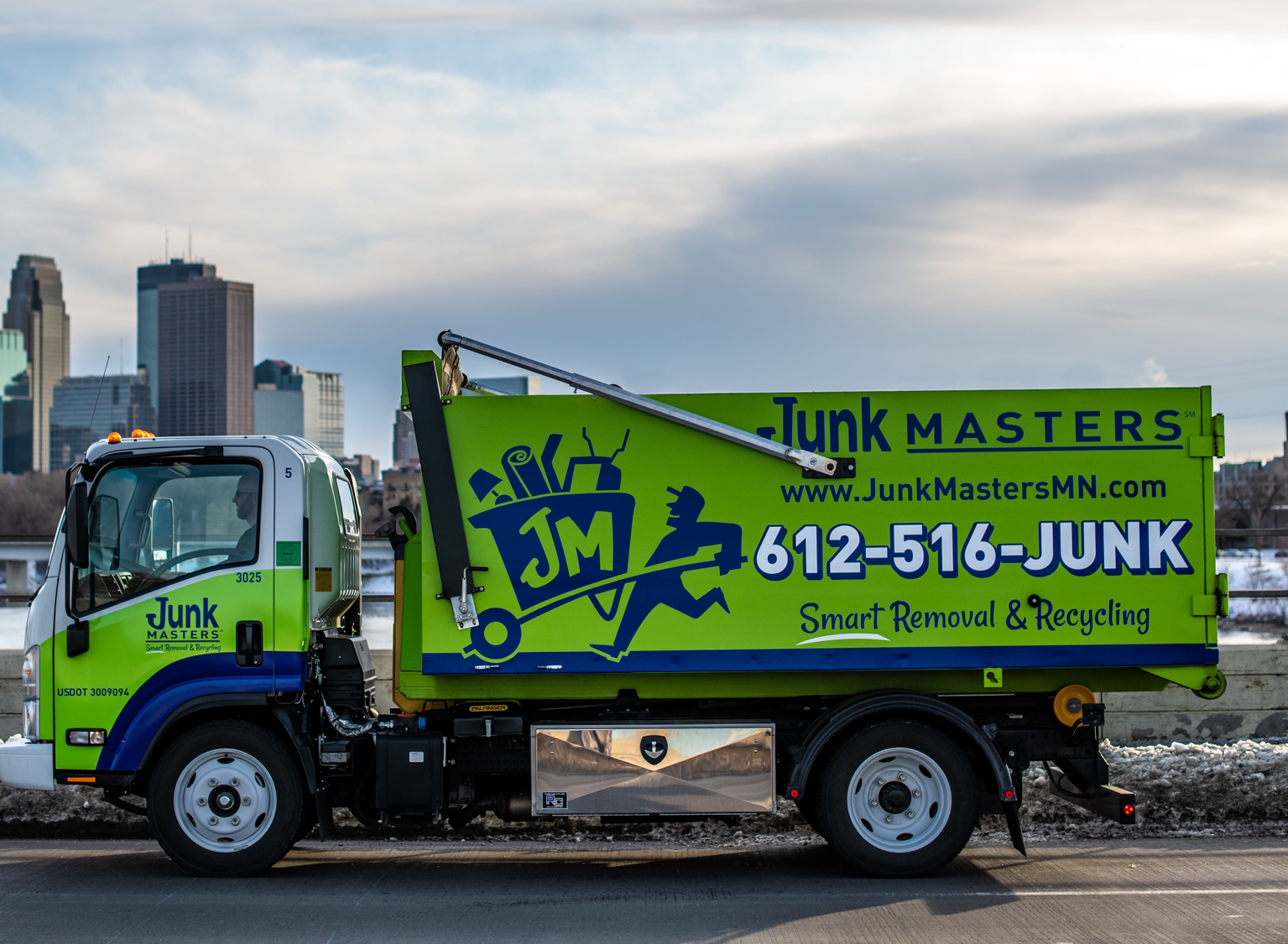 Junk Masters truck in the Twin Cities area to provide hot tub removal services