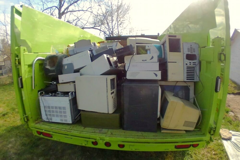 Junk Masters truck full of office materials collected during commercial cleanout services